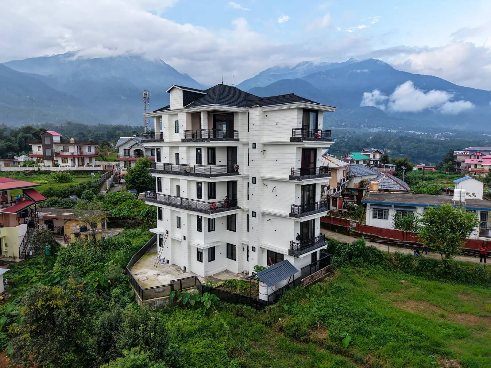 The White House with the Dhauladhar under morning cloud